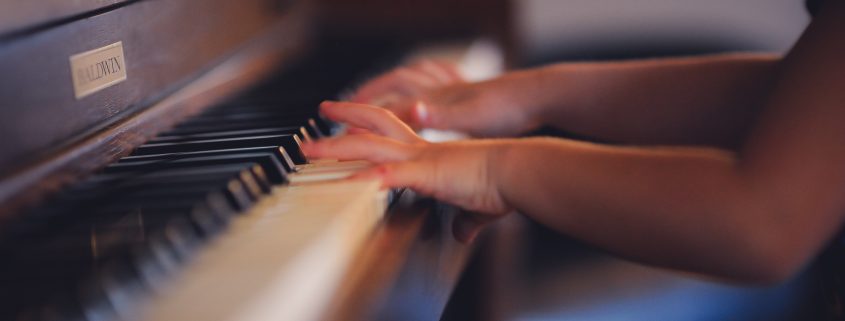 Child learning to play the piano. professional resume writer NJ, resume writer nj, cv, resume, cv resume